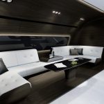 now-for-the-best-room-on-the-vip-plane-the-entertainment-zone-it-comes-with-a-more-roomy-wraparound-couch-and-a-smaller-coffee-table