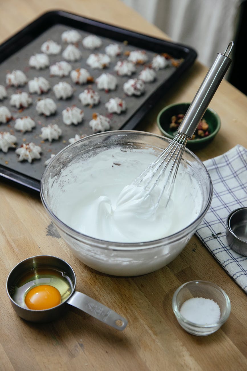 glass bowl with whipped egg whites