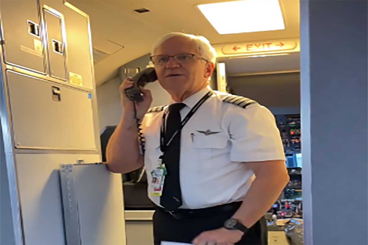 The pilot becomes emotional while talking to passengers before the flight;  He cries and everyone claps